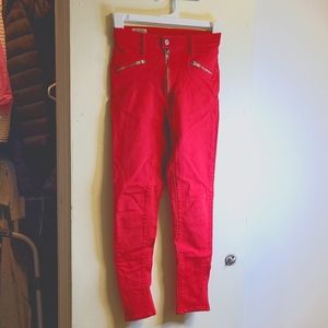 High rise stretchy red Levi jeans with zipper at ankles.  Barely worn. Size 26
